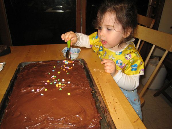 Phoebe sprinkles on the sprinkles.