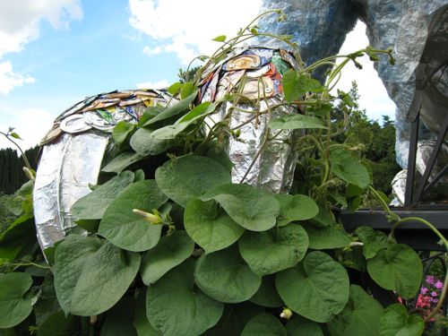 Another claw of the dragon, with vines growing over it.