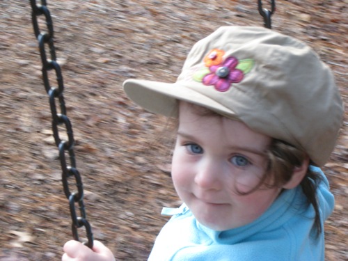 img_6773 Phoebe in a flowered cap, age 2 and a half.